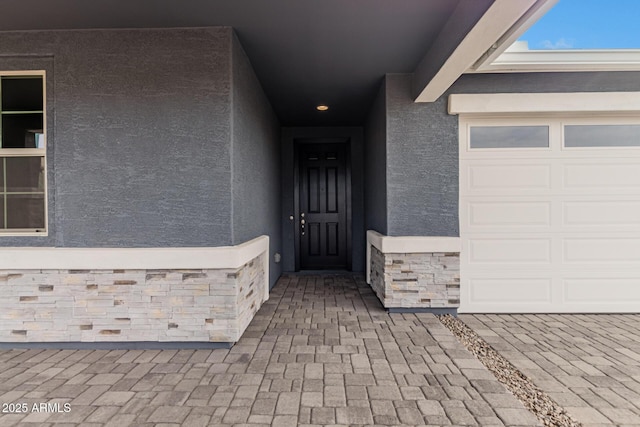 entrance to property featuring a garage