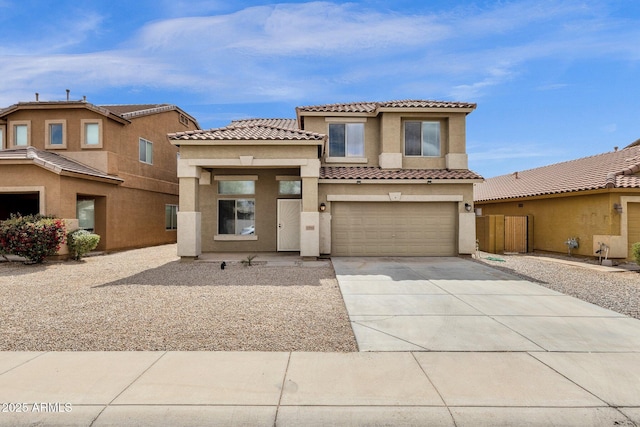 view of front of property featuring a tile roof, a garage, driveway, and stucco siding