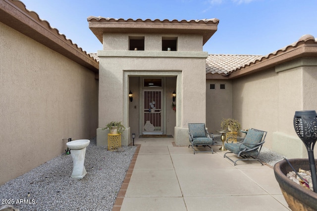 doorway to property featuring a patio area