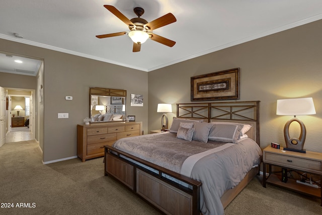 bedroom with ornamental molding, light colored carpet, and ceiling fan