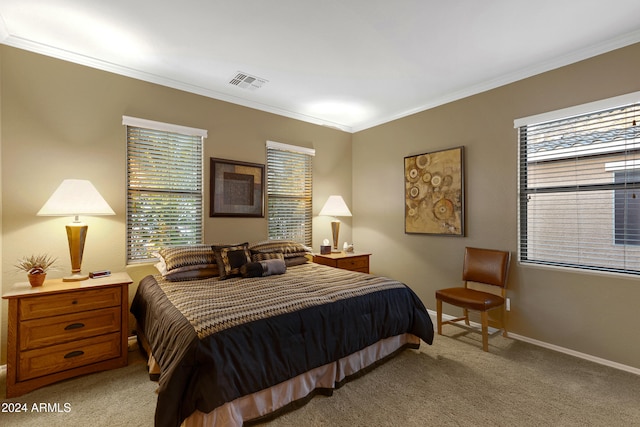 carpeted bedroom featuring ornamental molding