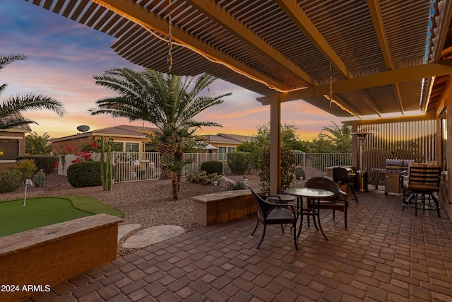 view of patio terrace at dusk