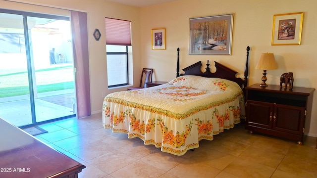 bedroom with access to exterior, baseboards, and light tile patterned floors