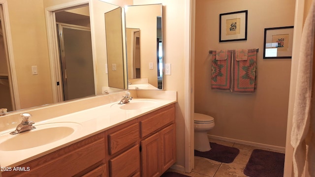 full bath with tile patterned flooring, a sink, toilet, and double vanity