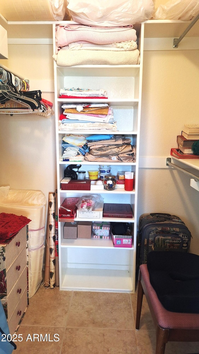 walk in closet featuring tile patterned floors