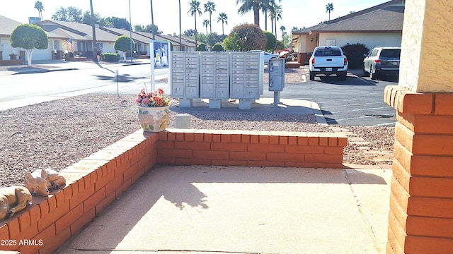 view of patio with mail area and a residential view