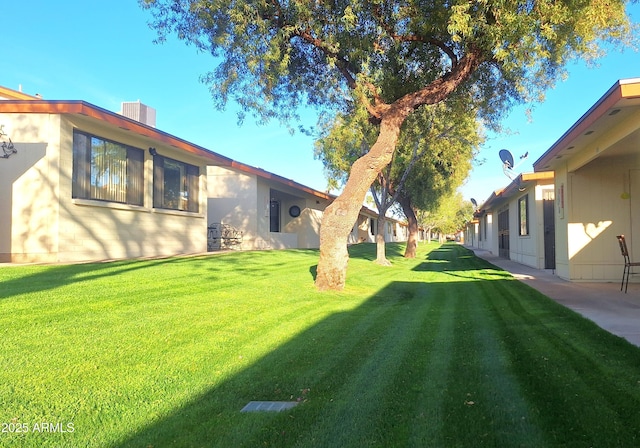 view of yard with central AC