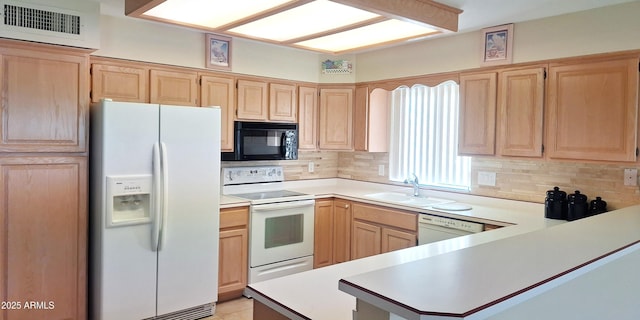 kitchen featuring white appliances, visible vents, light countertops, light brown cabinetry, and a sink