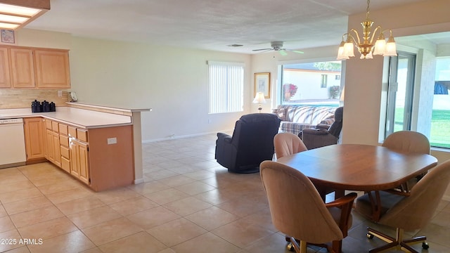 dining area featuring light tile patterned floors, ceiling fan with notable chandelier, visible vents, and baseboards