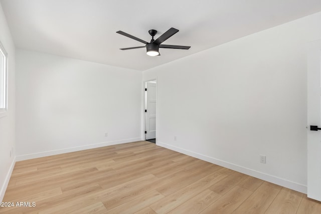 unfurnished room featuring ceiling fan and light wood-type flooring