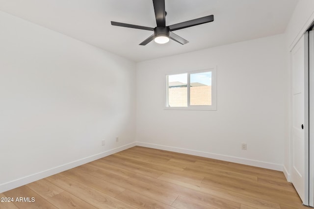 spare room with ceiling fan and light hardwood / wood-style flooring