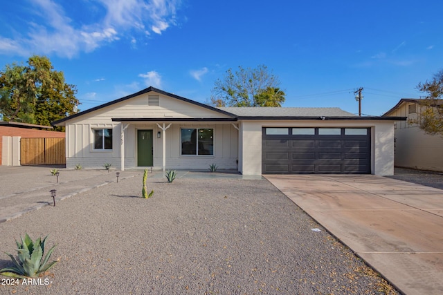 single story home featuring a garage