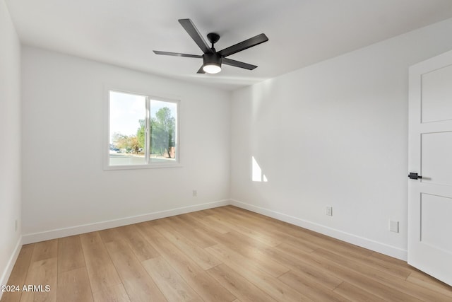 unfurnished room featuring light wood-type flooring and ceiling fan