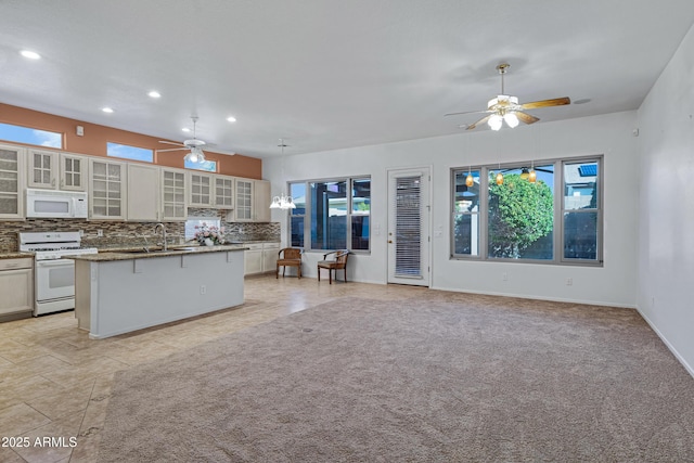 11413 S Coolwater Dr, Goodyear, AZ 85338 - kitchen with a sink, white appliances, tasteful backsplash, and ceiling fan