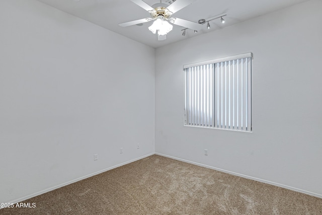 11413 S Coolwater Dr, Goodyear, AZ 85338 - carpeted empty room with baseboards, ceiling fan, and rail lighting