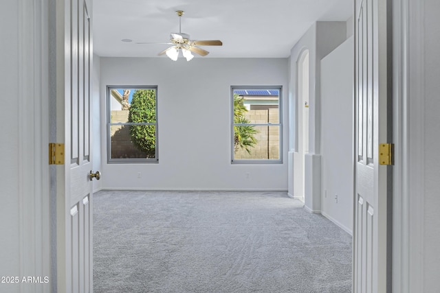 11413 S Coolwater Dr, Goodyear, AZ 85338 - carpeted spare room featuring baseboards and a ceiling fan