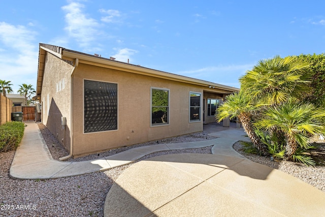11413 S Coolwater Dr, Goodyear, AZ 85338 - back of house with a patio, fence, and stucco siding
