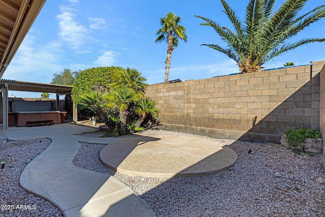 11413 S Coolwater Dr, Goodyear, AZ 85338 - view of yard featuring a patio area, a hot tub, and a fenced backyard