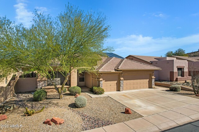 11413 S Coolwater Dr, Goodyear, AZ 85338 - pueblo revival-style home featuring a tiled roof, a garage, driveway, and stucco siding