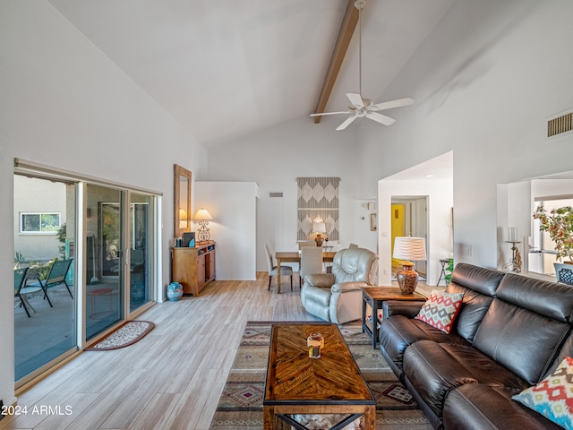 living room featuring ceiling fan, light wood-type flooring, beam ceiling, and high vaulted ceiling