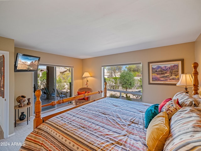 carpeted bedroom featuring access to outside