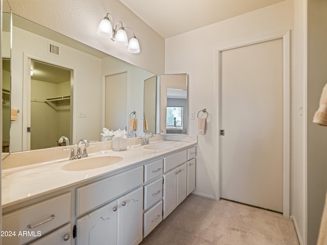 bathroom with oversized vanity and double sink