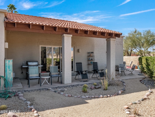 back of property featuring a patio area