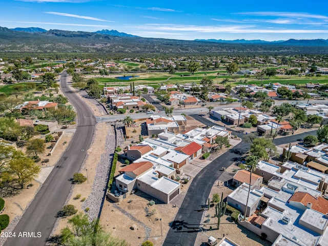 birds eye view of property featuring a mountain view