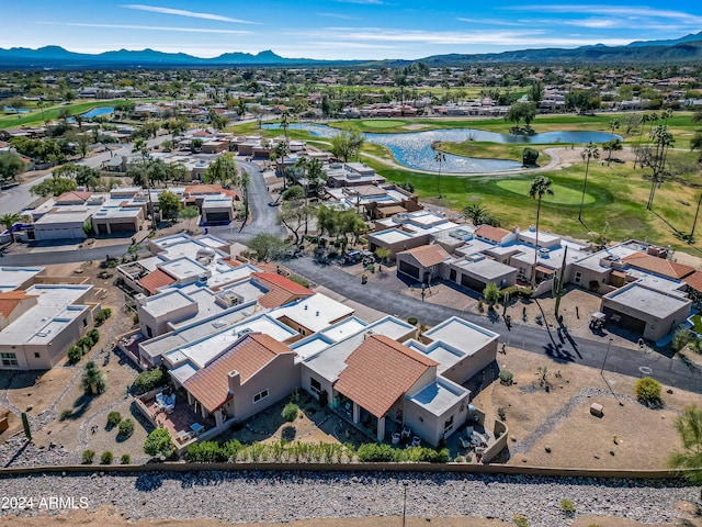 bird's eye view with a water and mountain view