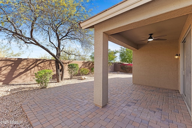 view of patio with ceiling fan and a fenced backyard