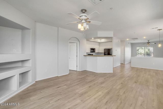 unfurnished living room with light hardwood / wood-style floors and ceiling fan