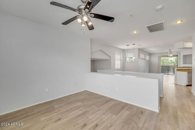 spare room featuring ceiling fan and light hardwood / wood-style flooring