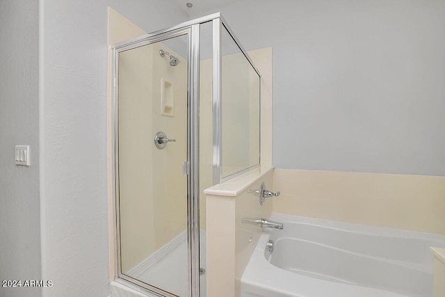 bathroom with separate shower and tub