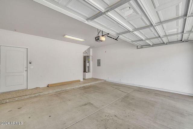 garage featuring a garage door opener, electric panel, and electric water heater