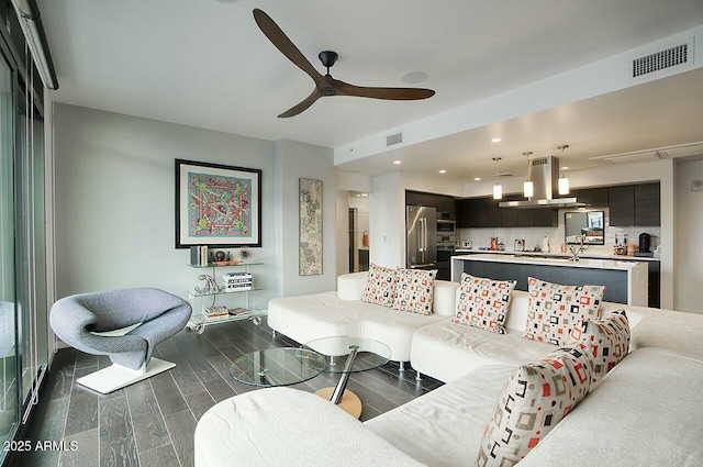 living room featuring ceiling fan