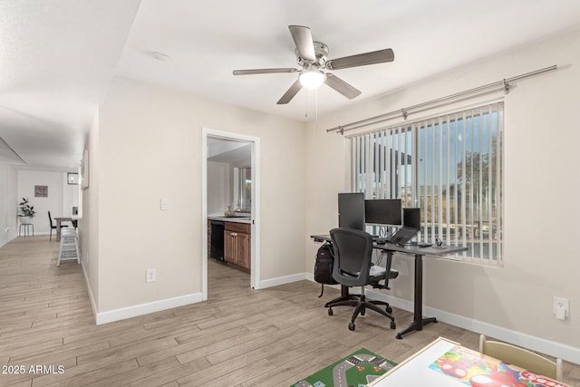 home office featuring ceiling fan and light wood-type flooring