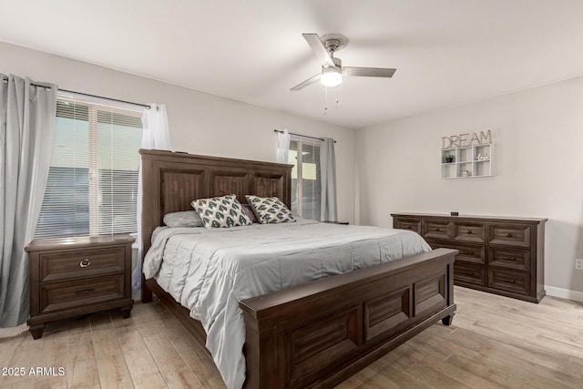 bedroom with ceiling fan and light wood-type flooring