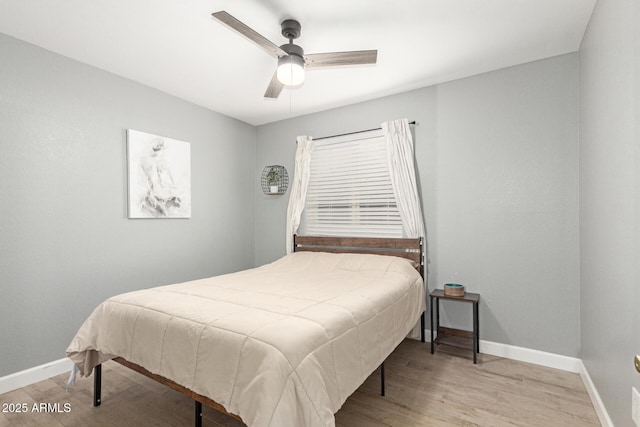 bedroom featuring light hardwood / wood-style floors and ceiling fan