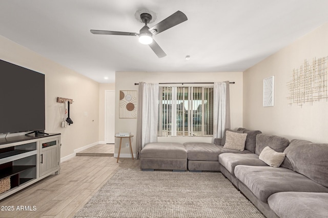 living room with ceiling fan and light hardwood / wood-style floors