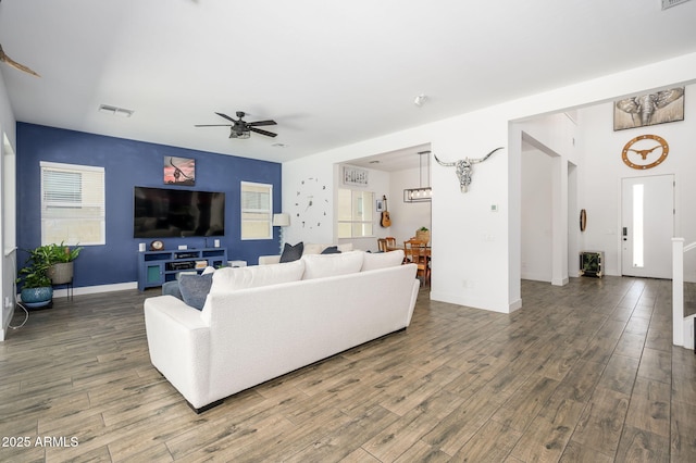 1221 E Paseo Way, Phoenix, AZ 85042 - living room with a ceiling fan, wood finished floors, and baseboards