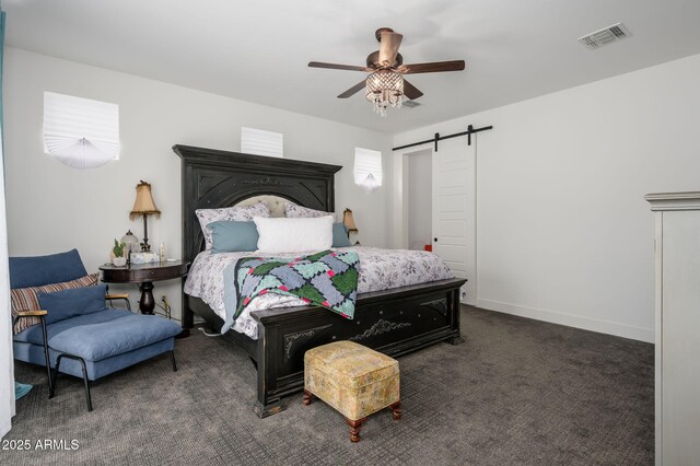 1221 E Paseo Way, Phoenix, AZ 85042 - bedroom with a barn door, carpet, a ceiling fan, and baseboards