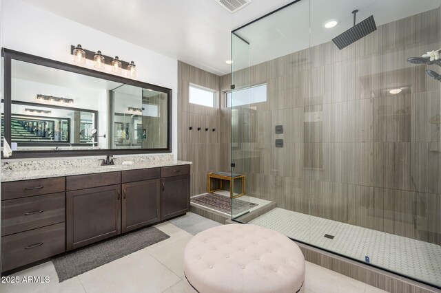 1221 E Paseo Way, Phoenix, AZ 85042 - full bath with tile patterned floors, a tile shower, and vanity