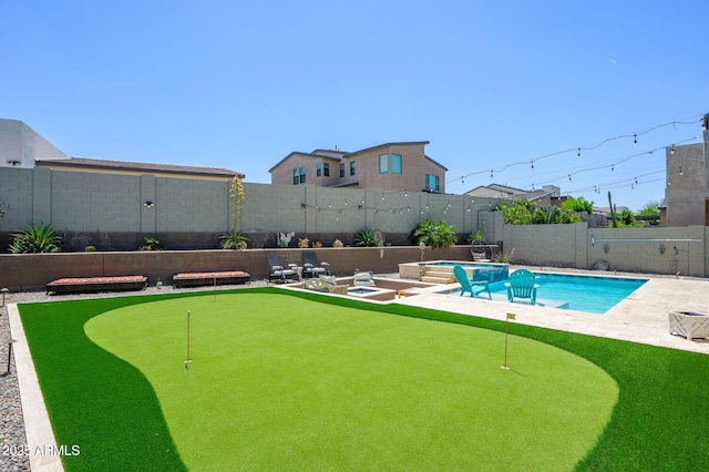 1221 E Paseo Way, Phoenix, AZ 85042 - view of pool featuring a putting area, a patio, a fenced backyard, and a pool with connected hot tub