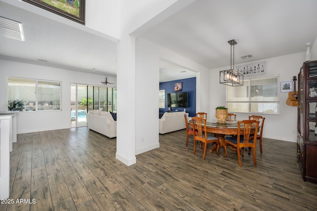 1221 E Paseo Way, Phoenix, AZ 85042 - dining room with wood finished floors, a chandelier, and baseboards