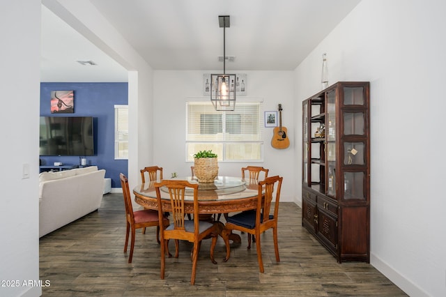 1221 E Paseo Way, Phoenix, AZ 85042 - dining area featuring dark wood-style floors and baseboards