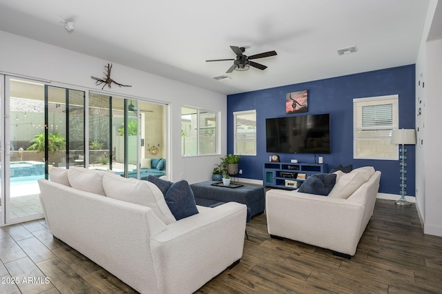 1221 E Paseo Way, Phoenix, AZ 85042 - living area featuring dark wood-type flooring, ceiling fan, and baseboards