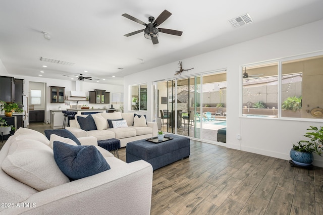 1221 E Paseo Way, Phoenix, AZ 85042 - living area featuring ceiling fan, wood finished floors, recessed lighting, and baseboards