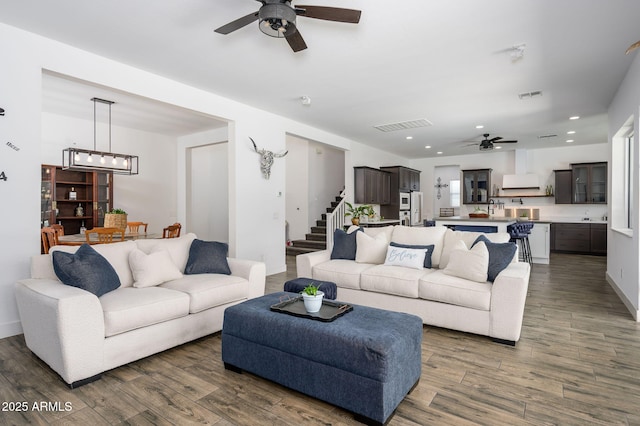 1221 E Paseo Way, Phoenix, AZ 85042 - living area featuring a ceiling fan, dark wood finished floors, stairway, and recessed lighting