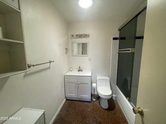 1529 W Eva St, Phoenix, AZ 85021 - bathroom with vanity, toilet, tile patterned floors, baseboards, and bath / shower combo with glass door