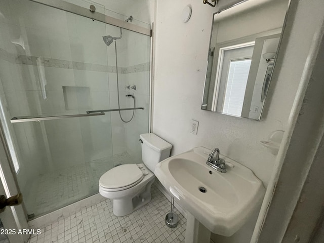 1529 W Eva St, Phoenix, AZ 85021 - bathroom with a sink, tile patterned flooring, a stall shower, and toilet